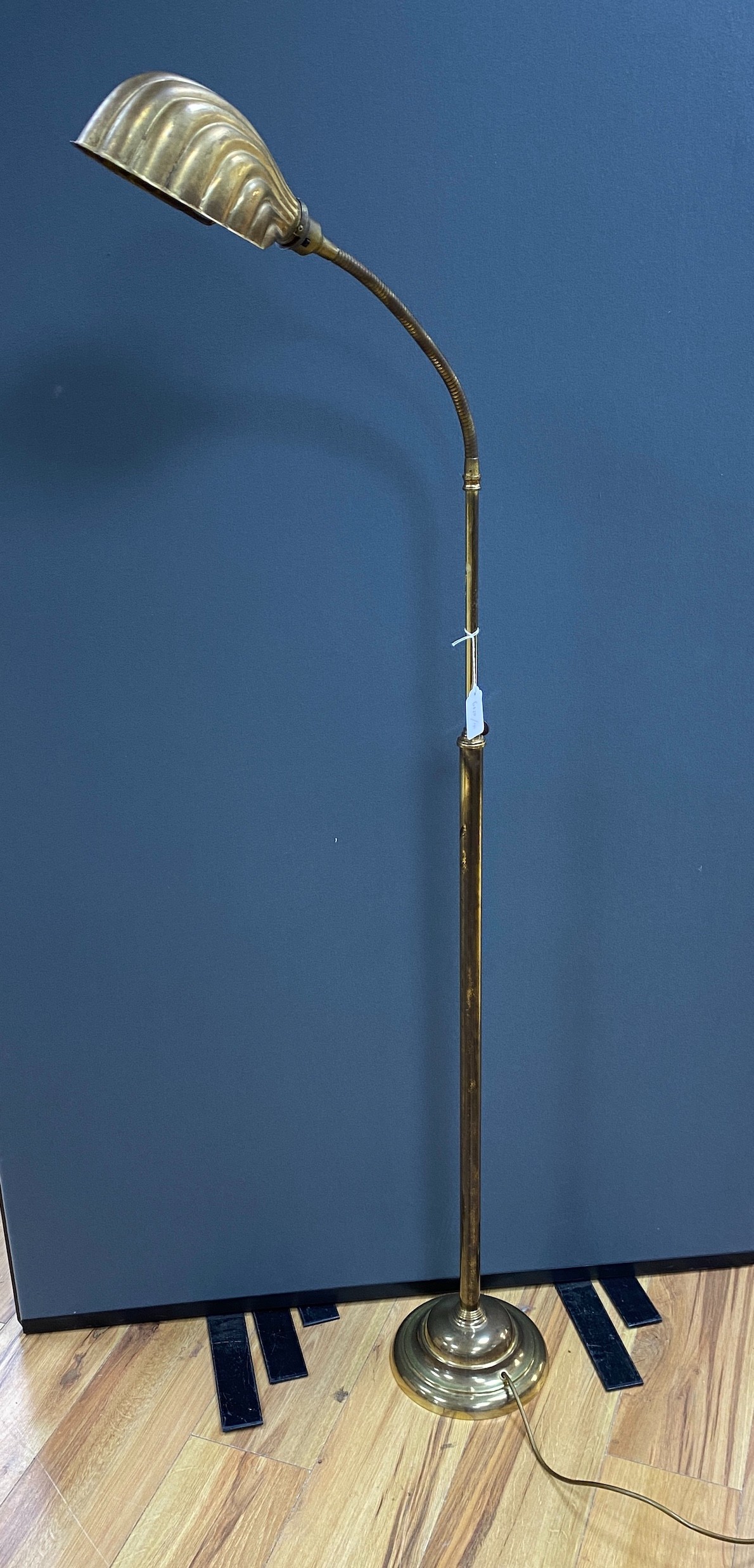 An early 20th century brass adjusting telescopic floor lamp